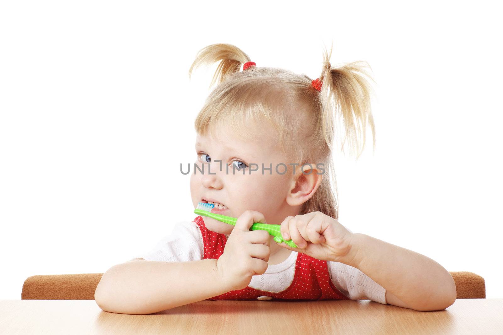 child with toothbrush in hands