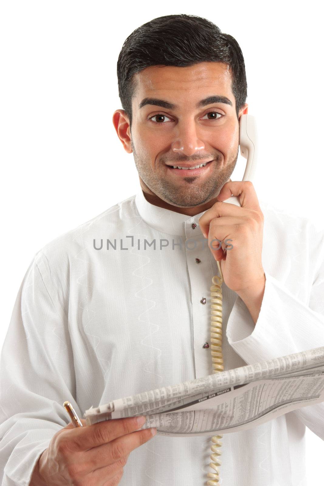 Happy businessman, accountant, banker, stockbroker, etc on the phone and holding a newspaper at the finance section.