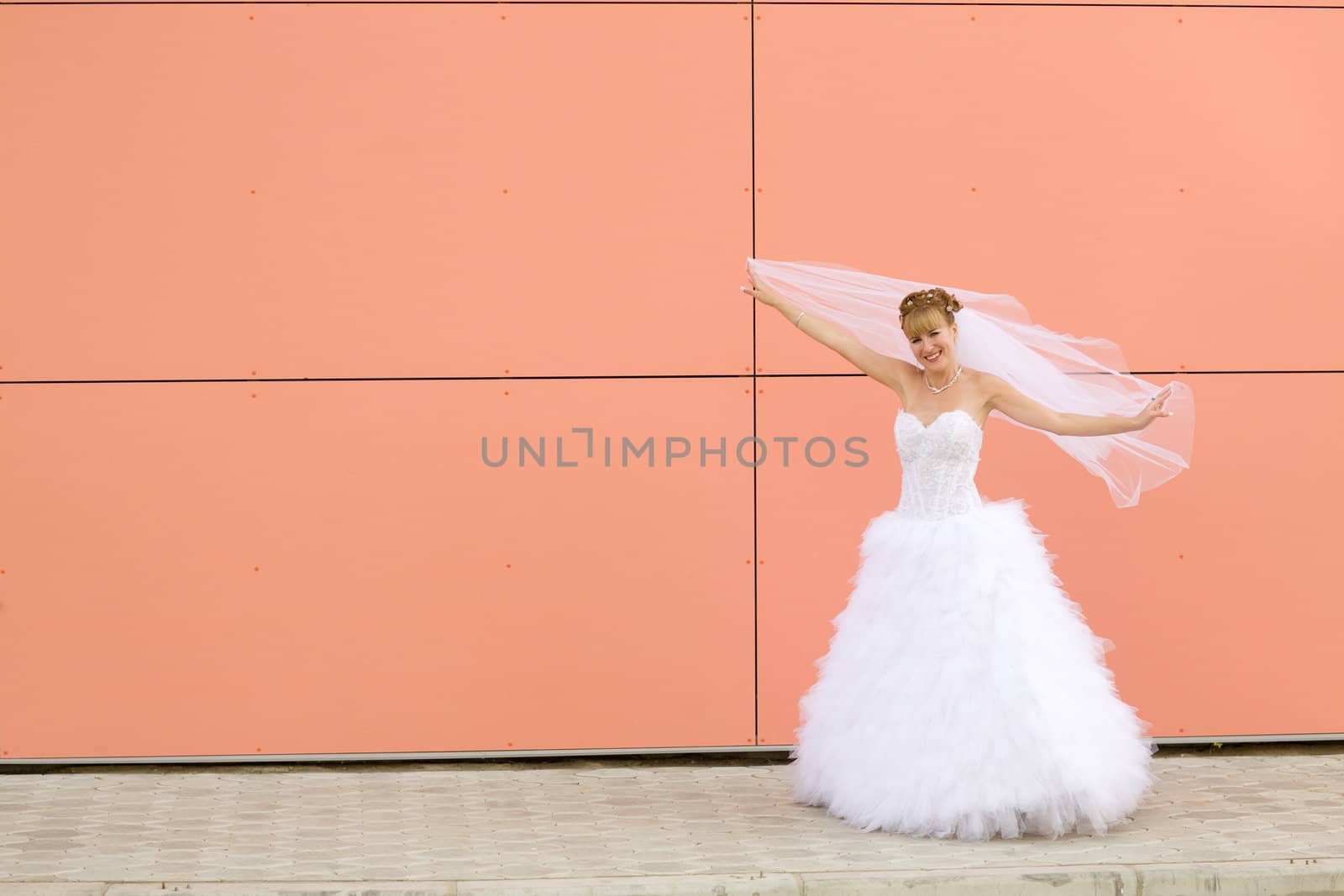 young bride near the wall