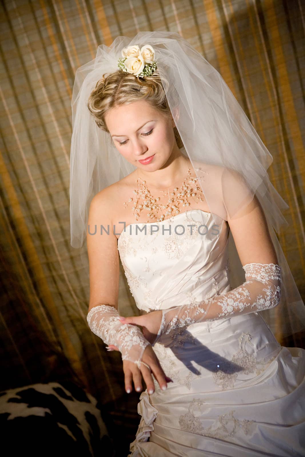 bride puts on a white glove by vsurkov