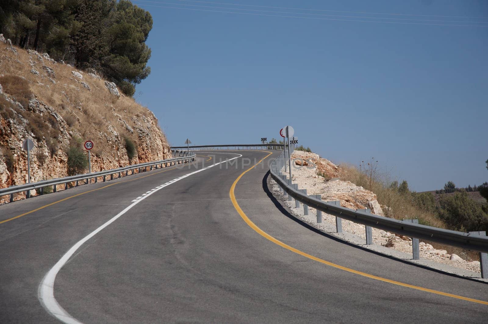 A view of an empty highway road .