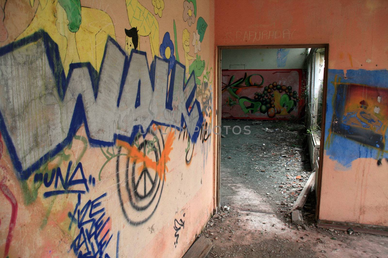 old house with graffiti in the walls