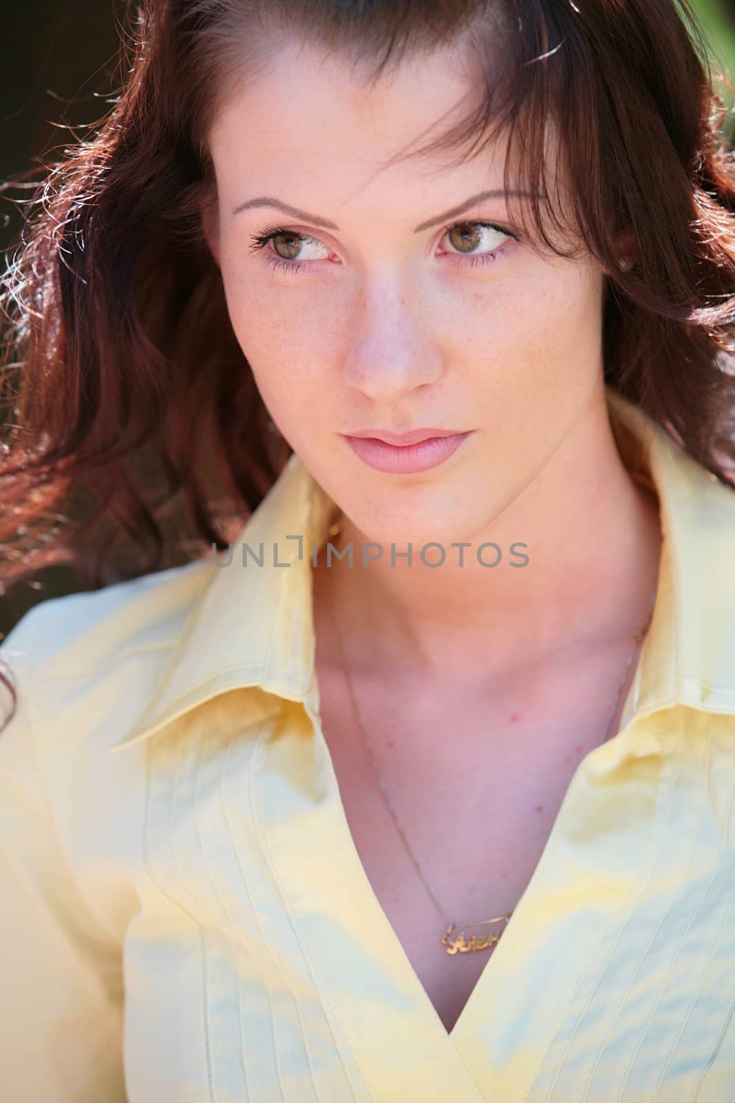 beautiful young woman in yellow dress, closeup portrait