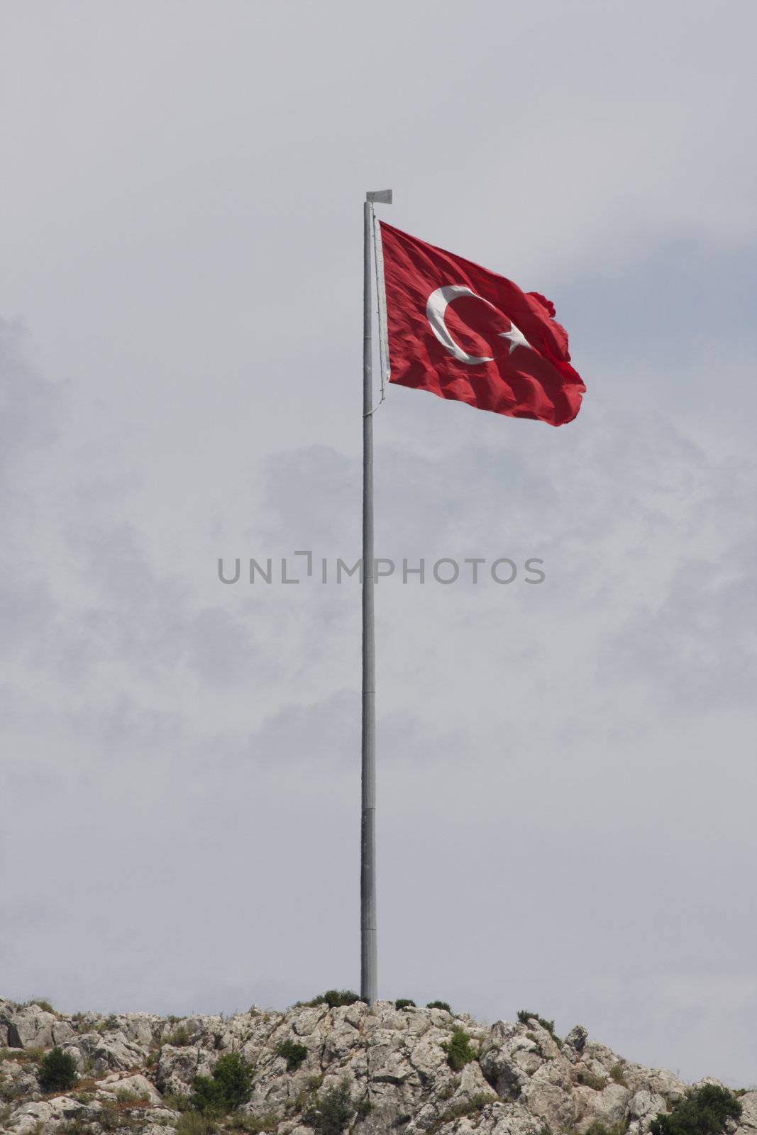 Turkish Flag blowing in the wind on a flag pole