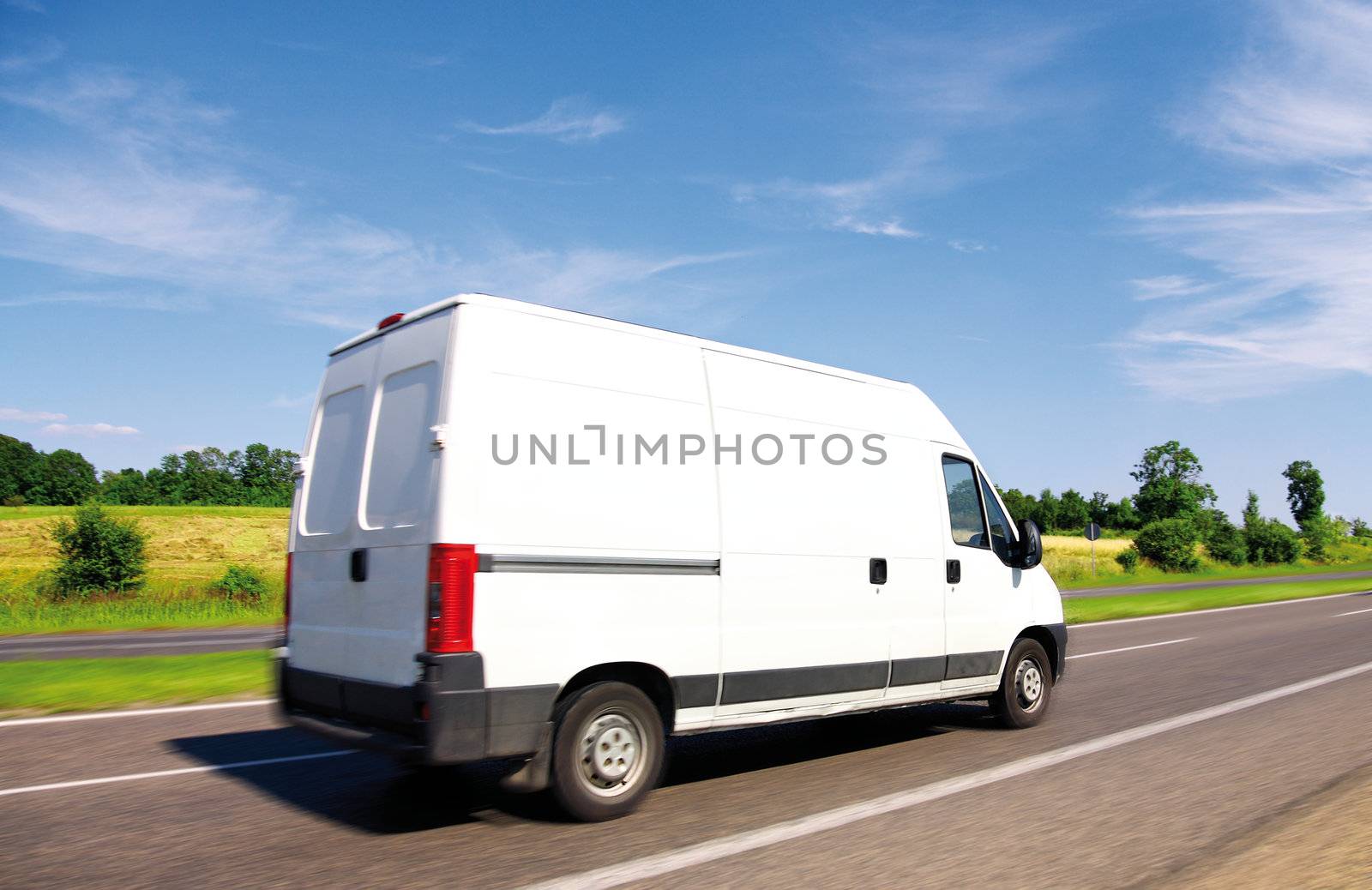 White delivery mini truck on highway  by majeczka