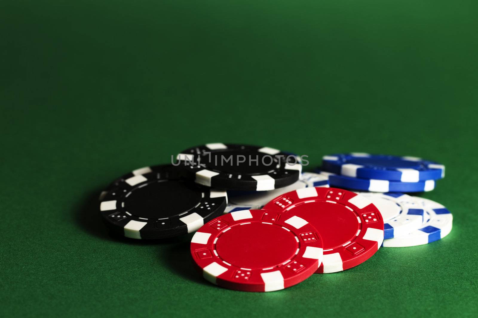 casino chips on green background