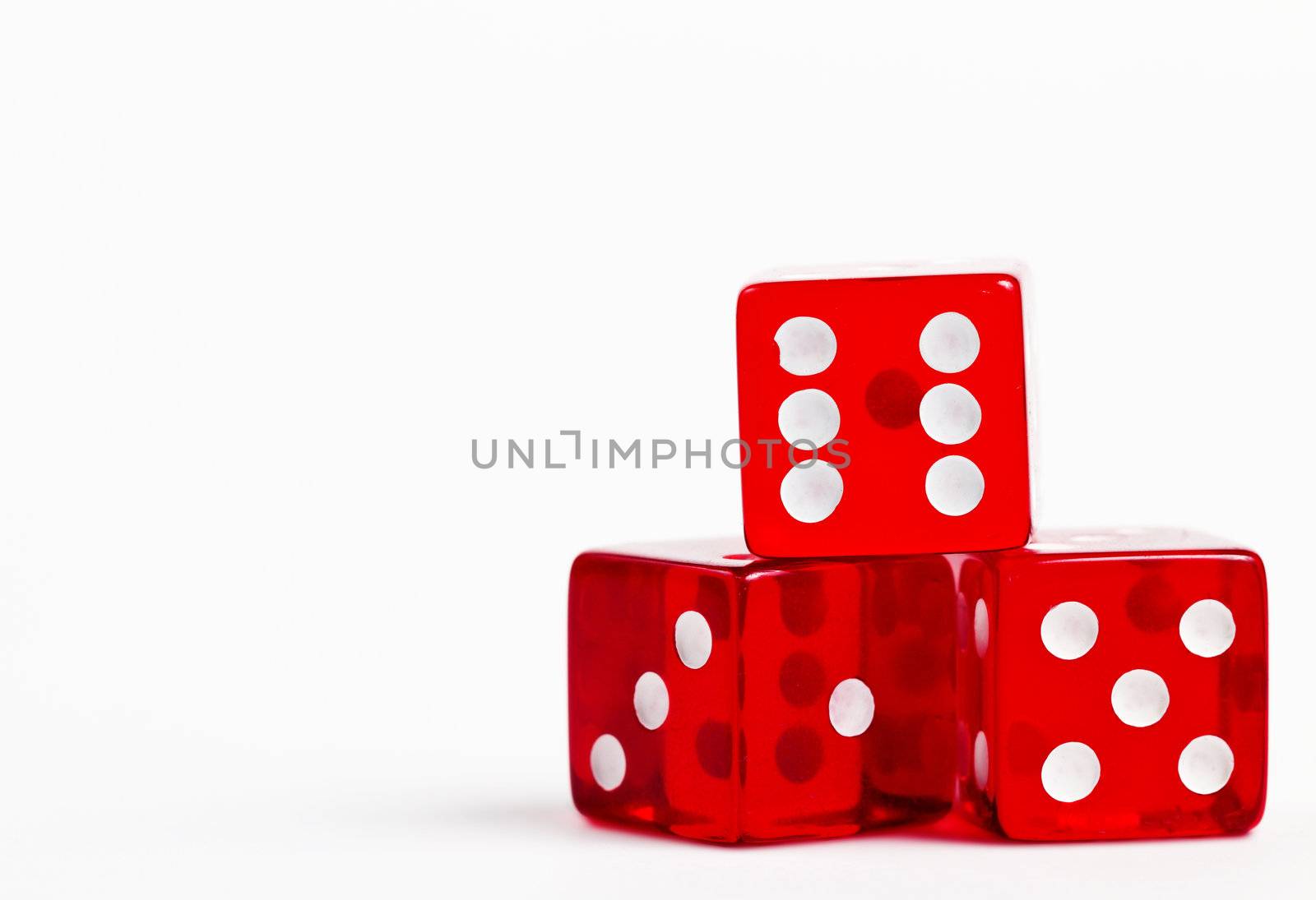 three red dices on white background