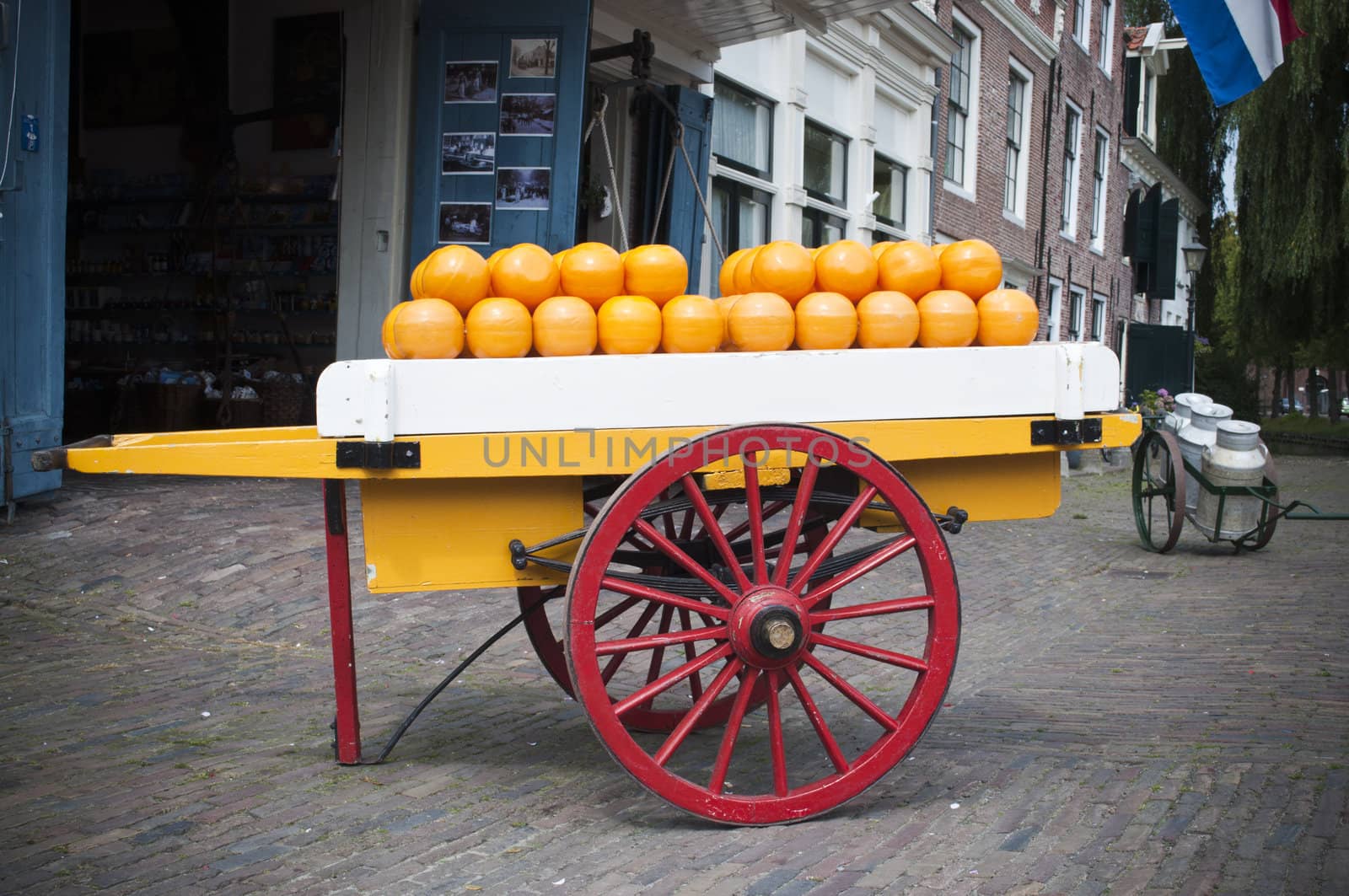 Cart in front of a market full of cheese