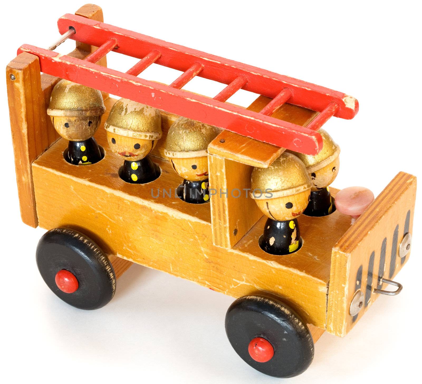 Ancient wooden toy fire-engine on a white background