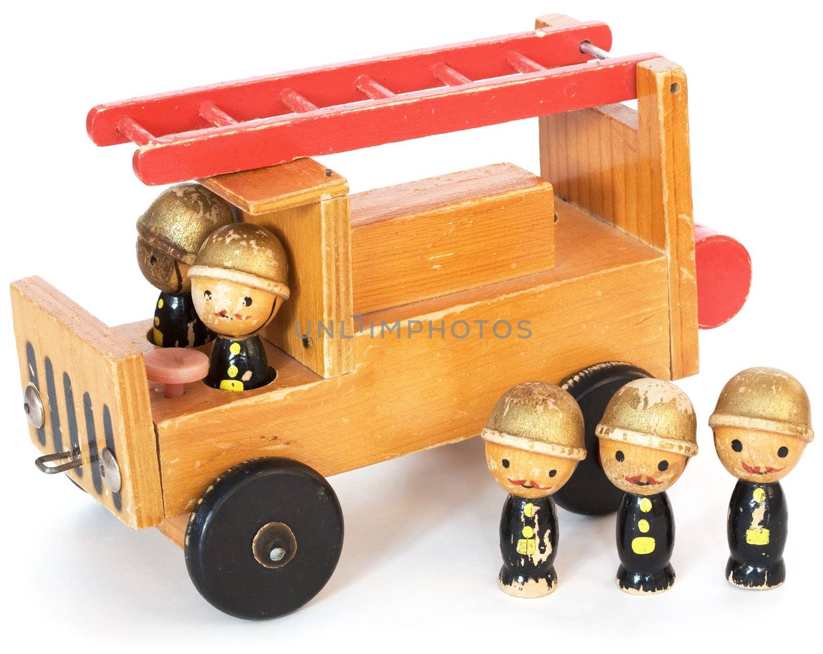 Old wooden toy fire-engine on a white background