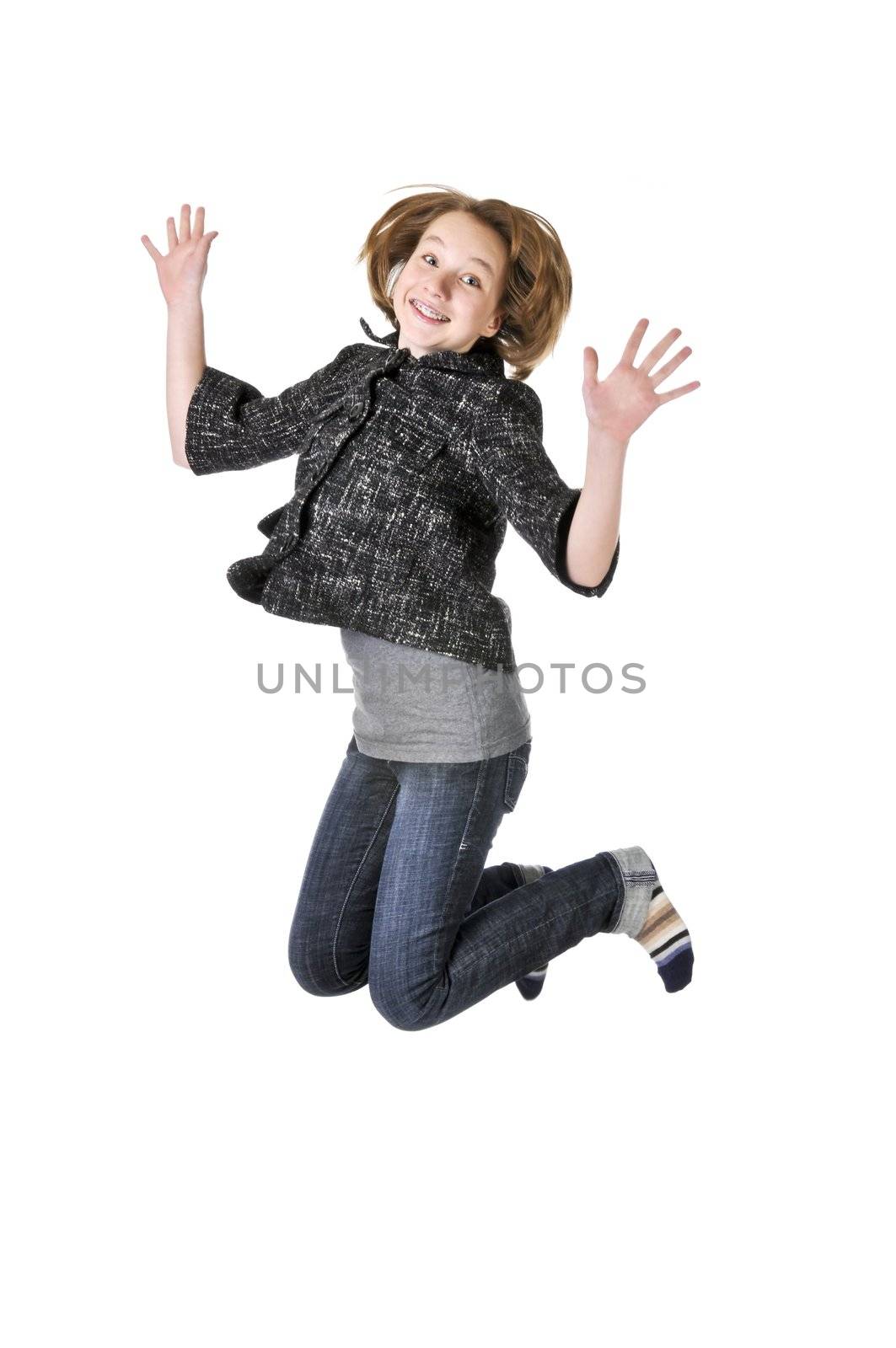 Teenage girl jumping isolated on white background