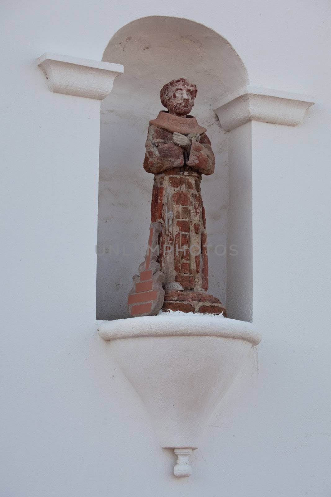 Humorous statue of saint with guitar by steheap