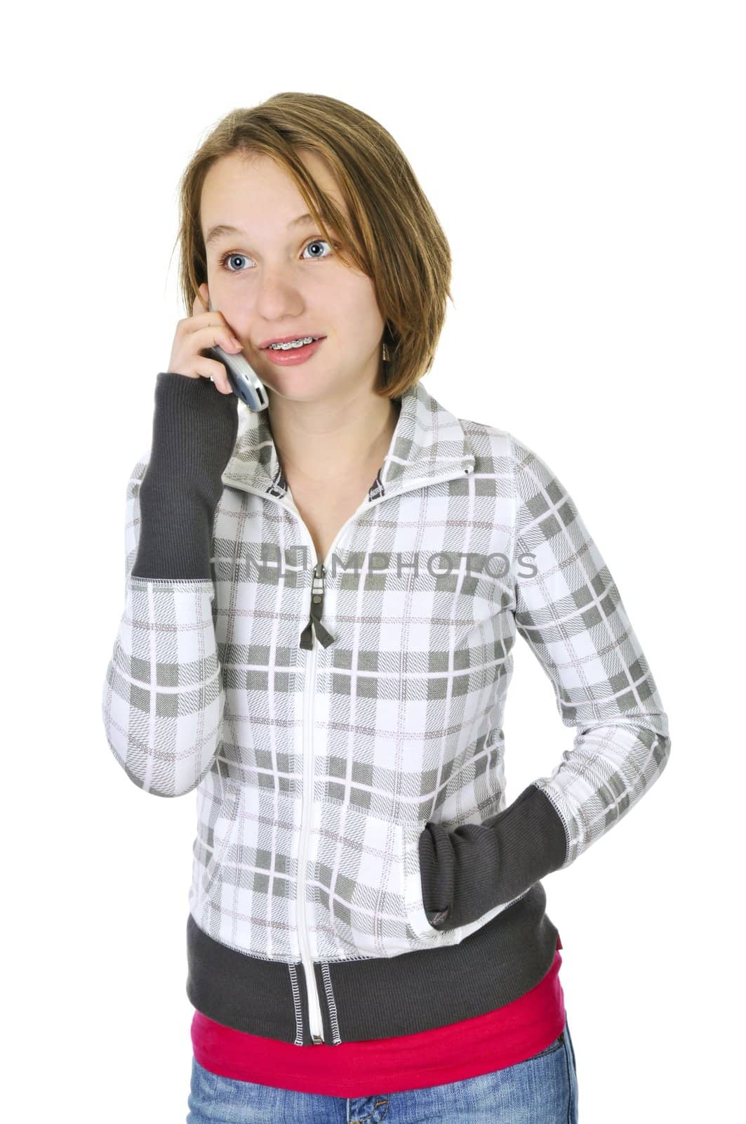 Teenage girl talking on a cell phone isolated on white background