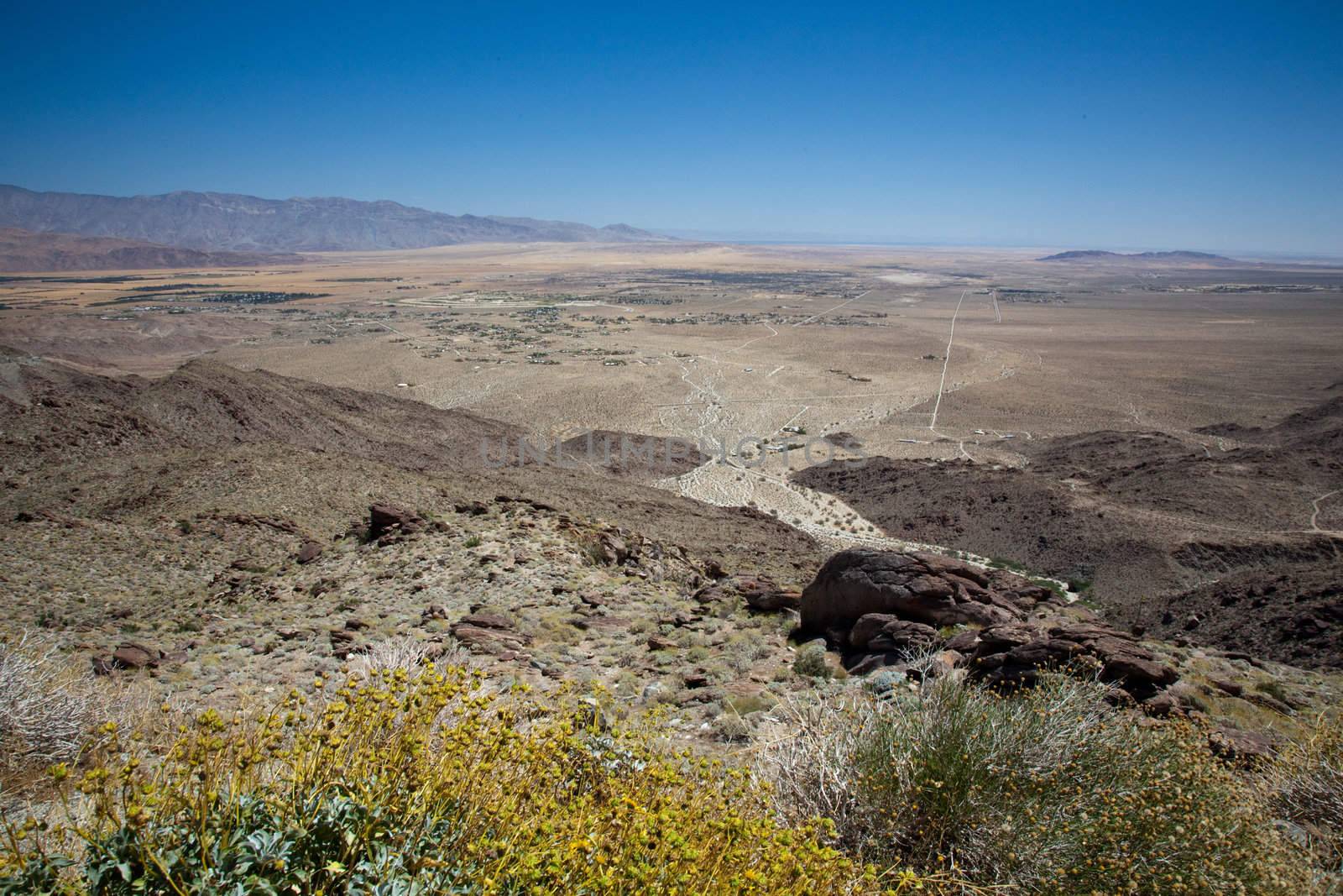 Anza Borrego desert and state park with the city of Borrego Springs in the valley framed by yellow bush