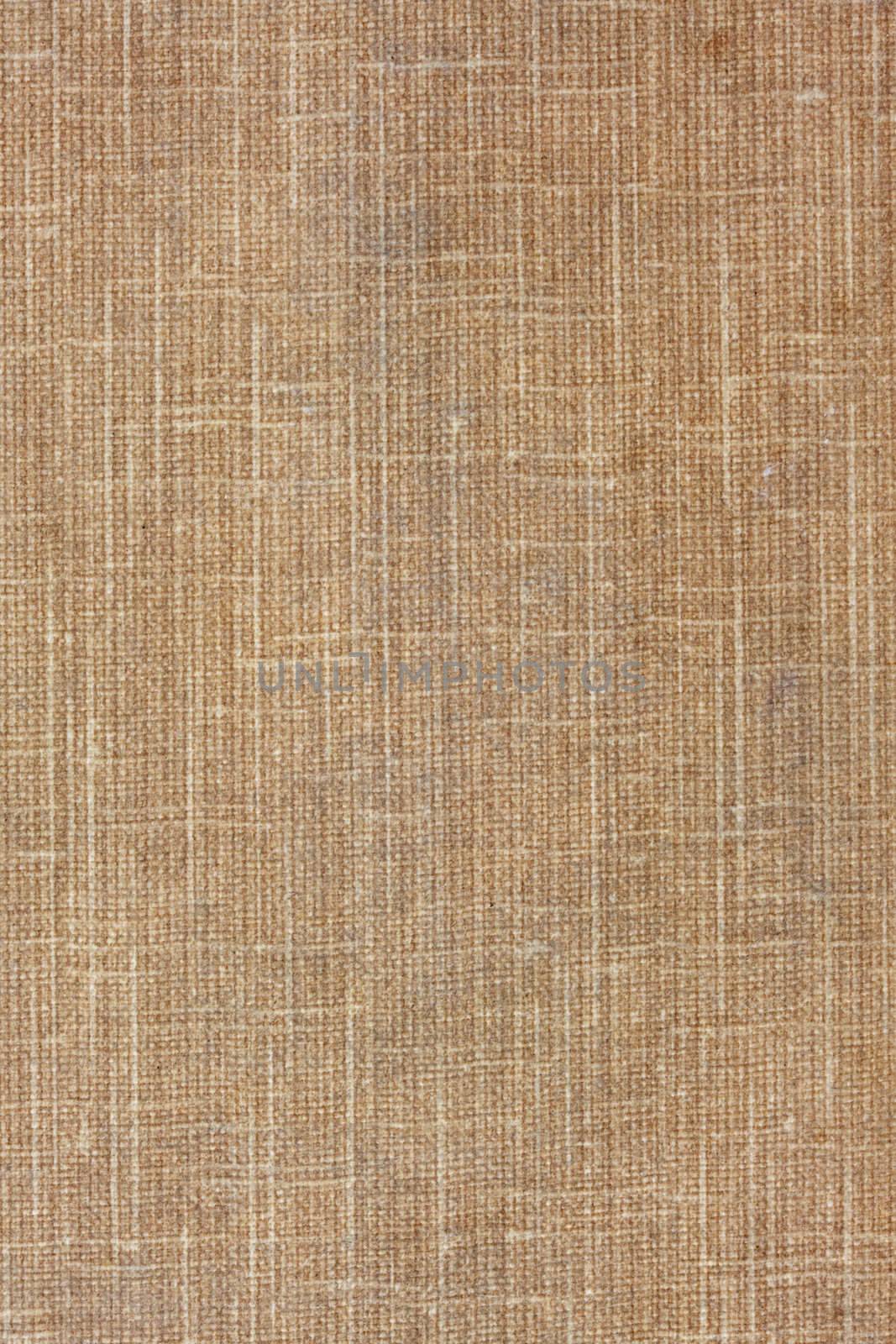 brown (beige) textile background from a vintage book cover with some stains and scratches