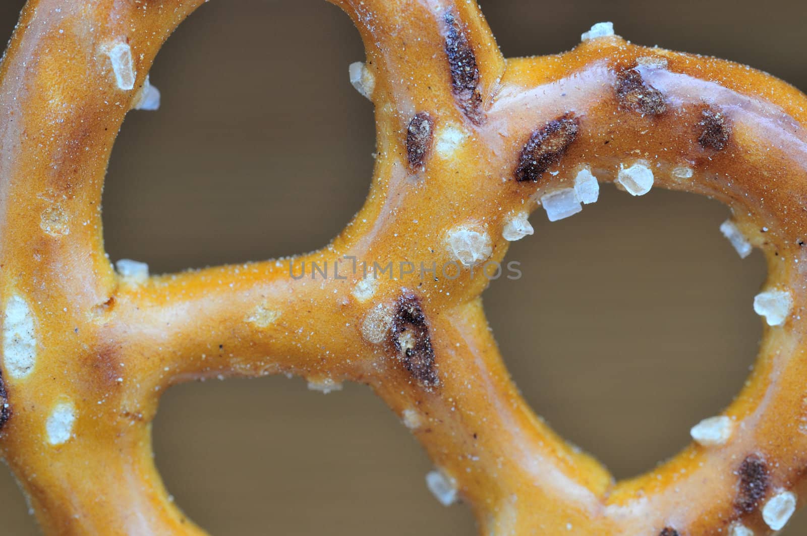 Macro shot of a pretzel with salt cyrstals.