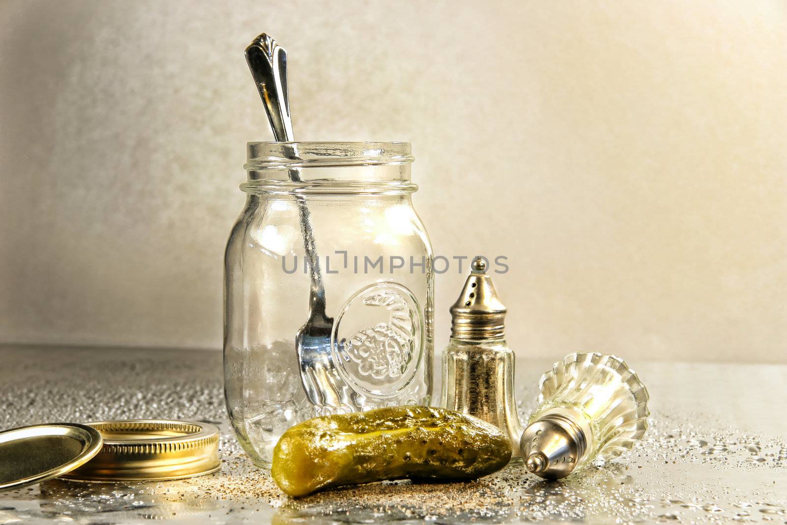 Pickle with a jar and antique salt and pepper shakers