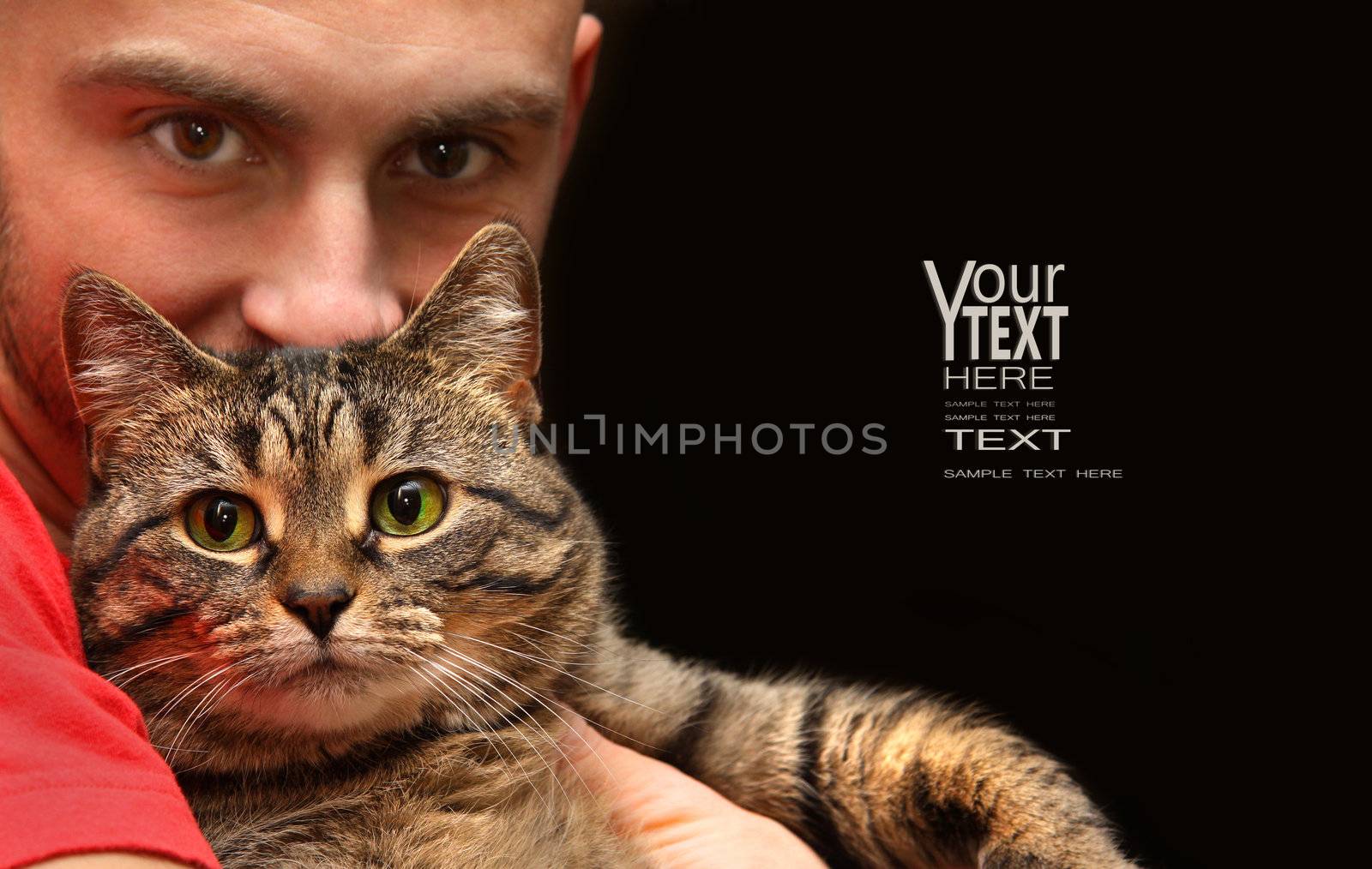 Man holding tabby cat with big green eyes by Sandralise