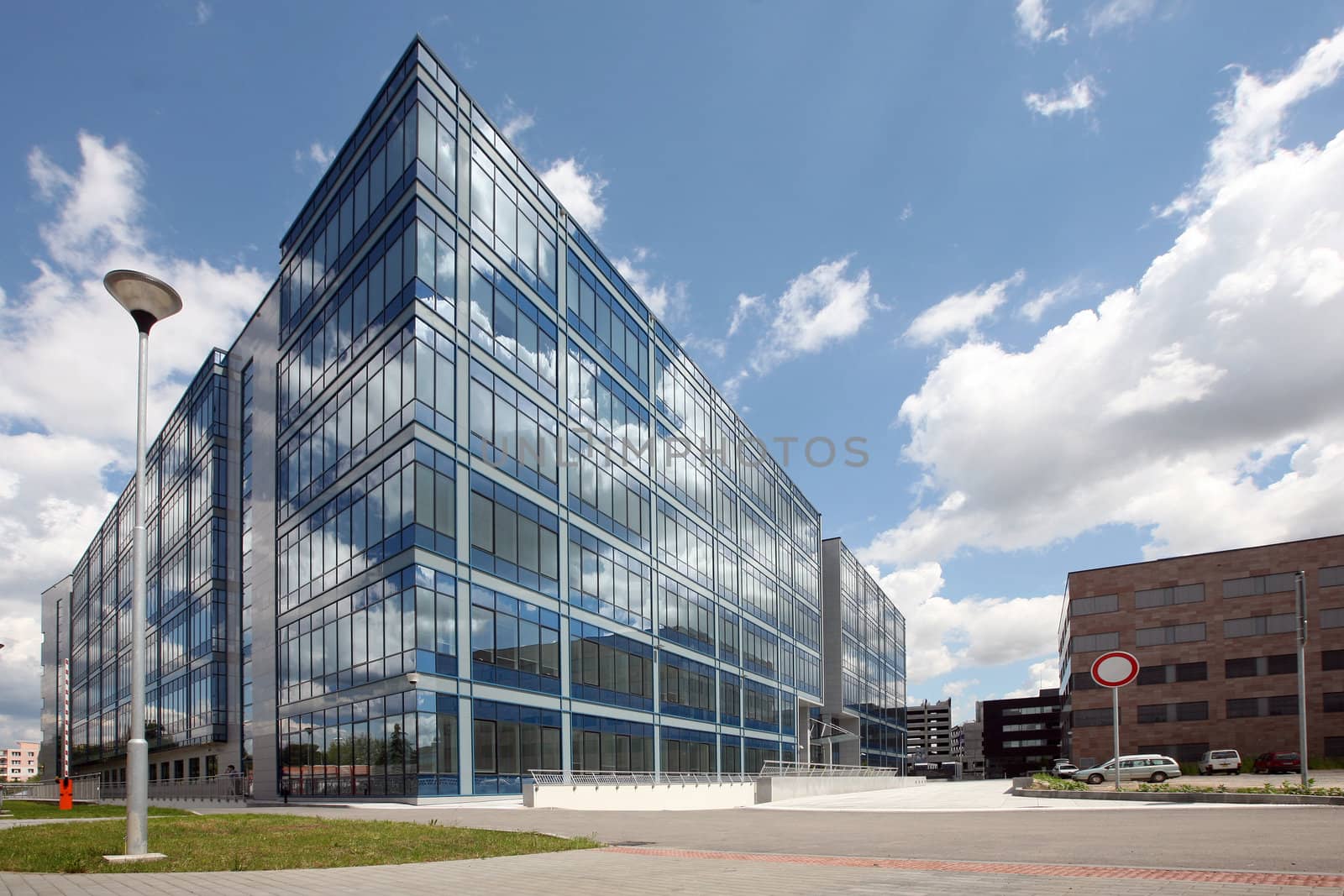 New modern futuristic building and blue skyes in cloudy day by haak78