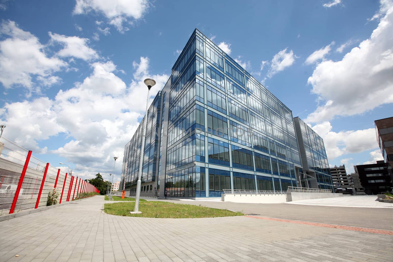 New modern futuristic building and blue skyes in cloudy day by haak78