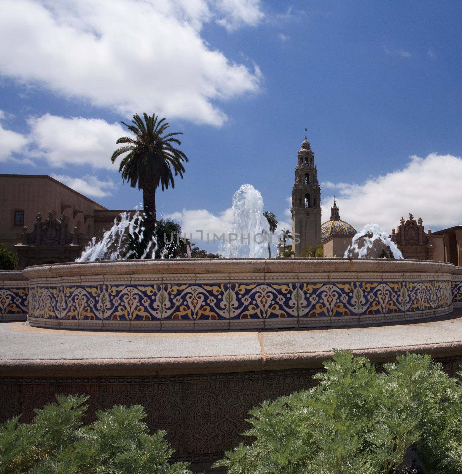 View of the ornate California Tower from Balboa Park in San Diego over fountain