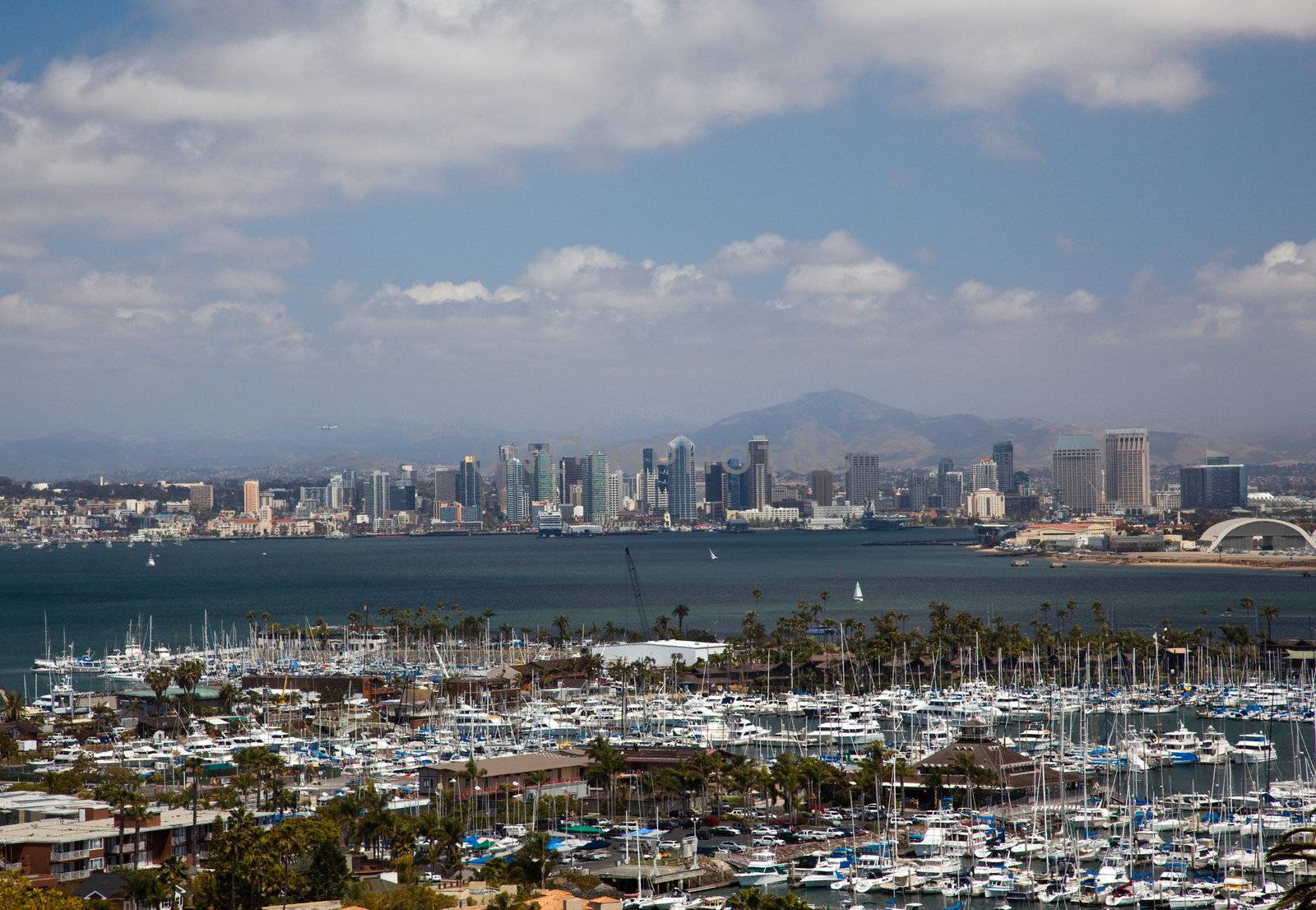 San Diego Skyline over yachts in harbor by steheap