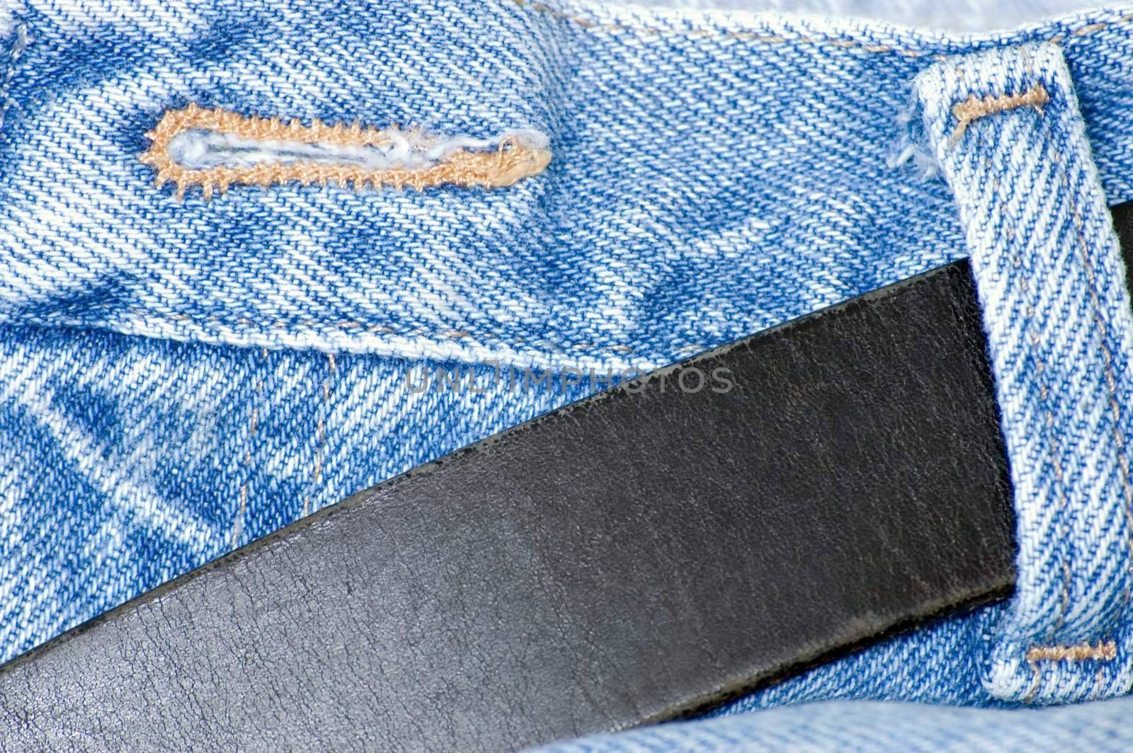 A button hole on a pair of denim jean pants.