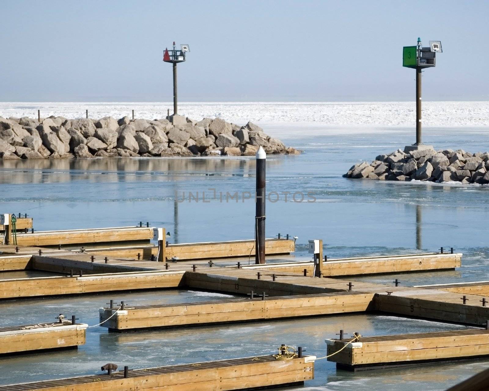 Frozen boating entrance to a marina on Lake Erie.
