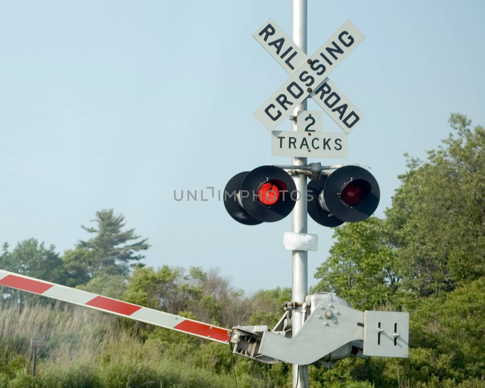 A railroad crossing signal warning of oncoming train.
