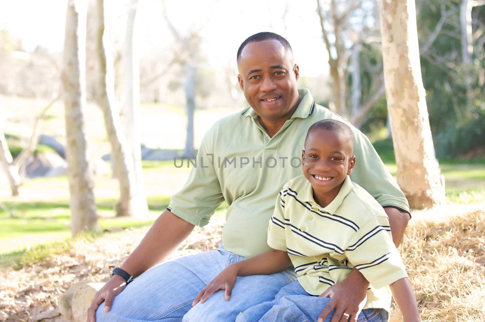 Man and Child Having fun in the park.