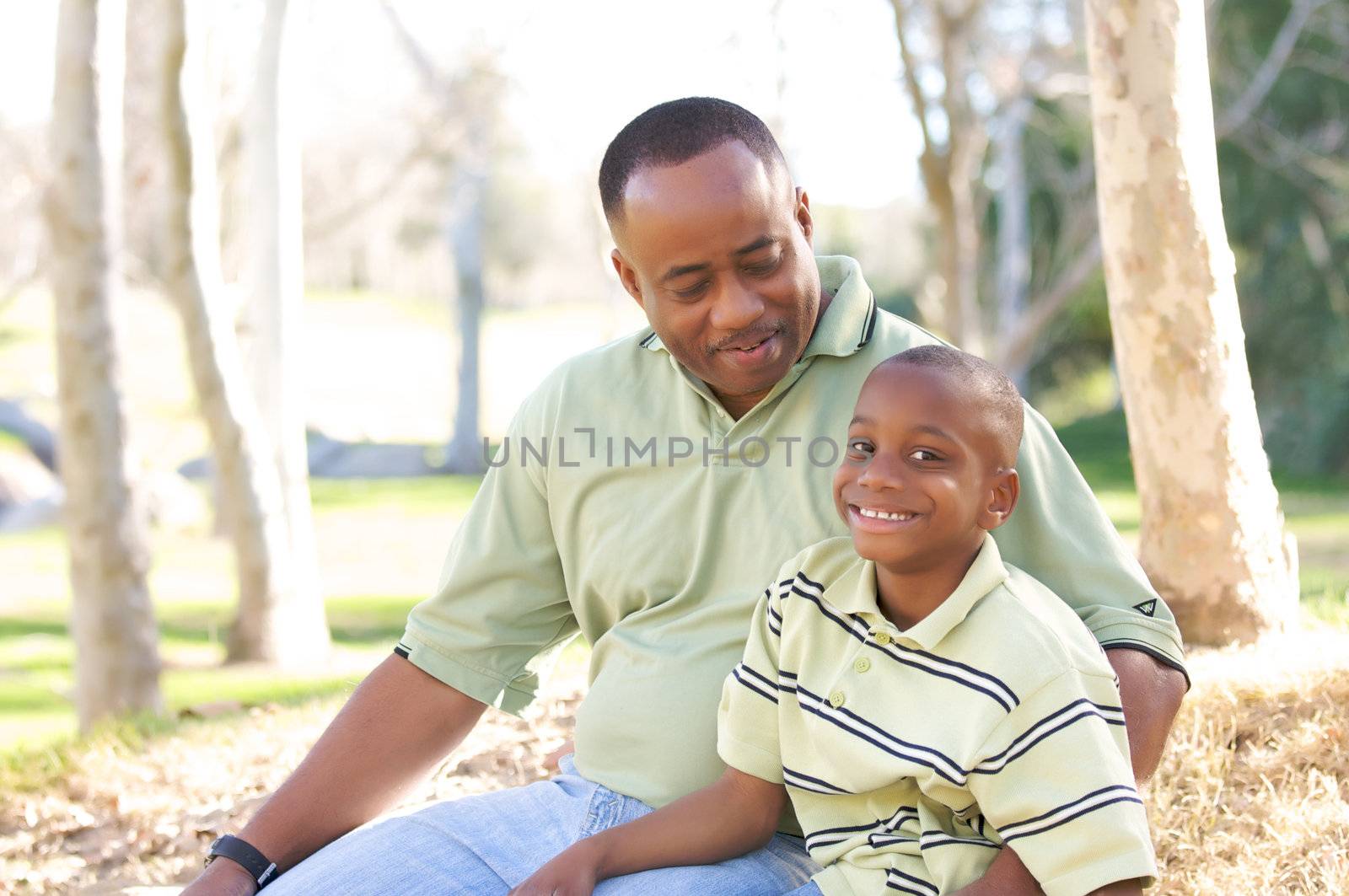 Man and Child Having fun in the park.