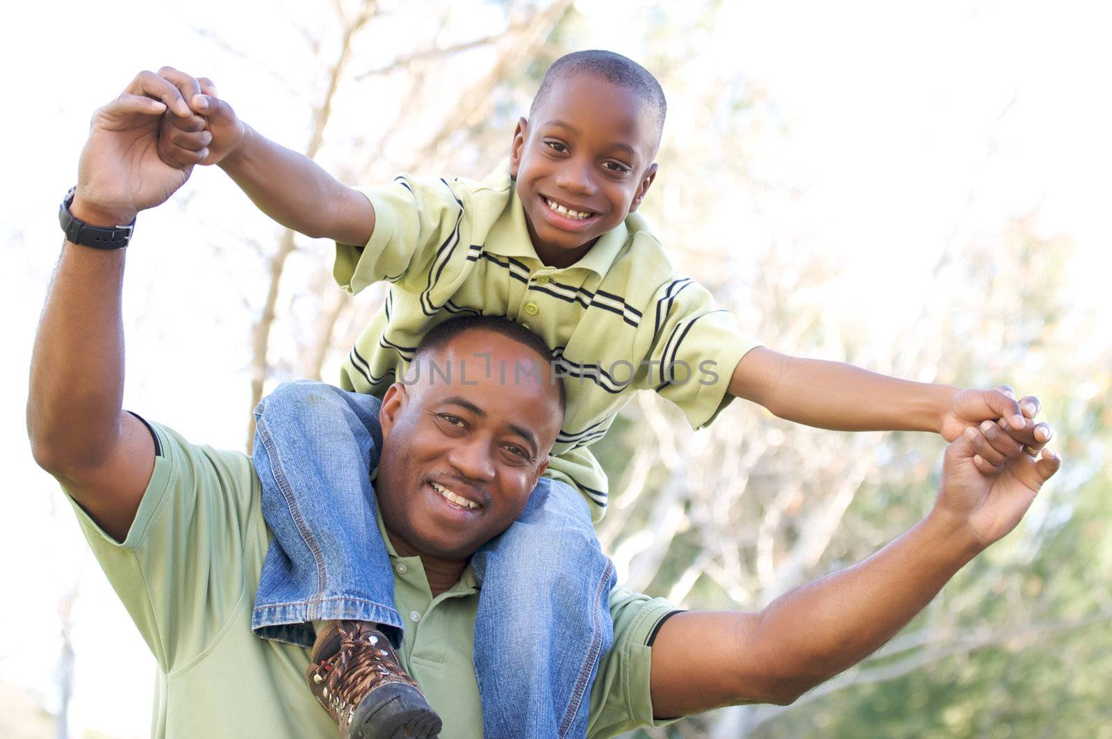 Man and Child Having fun in the park.