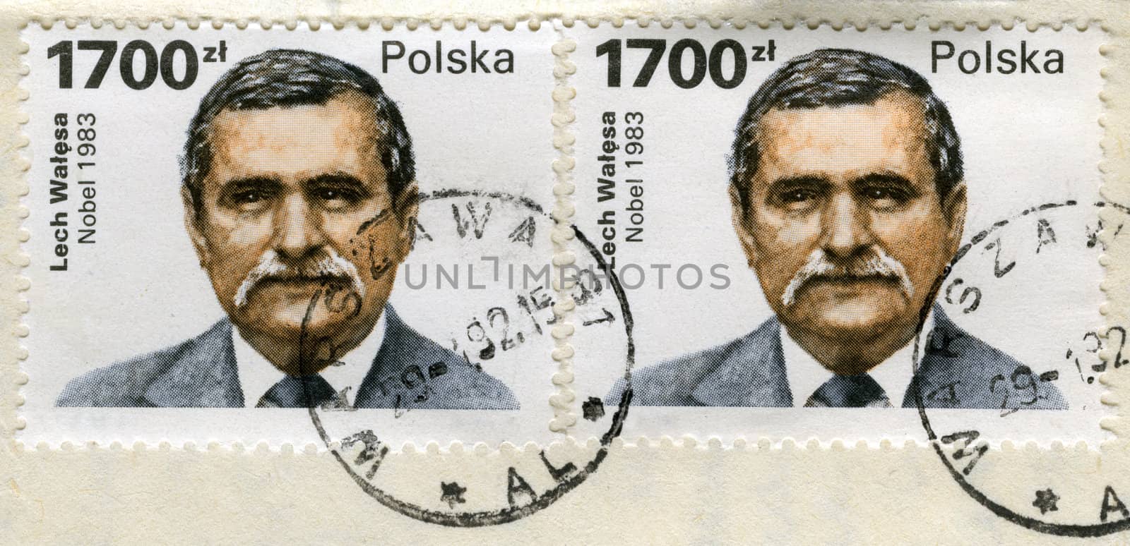 two old post stamps with Lech Walesa portrait by PixelsAway