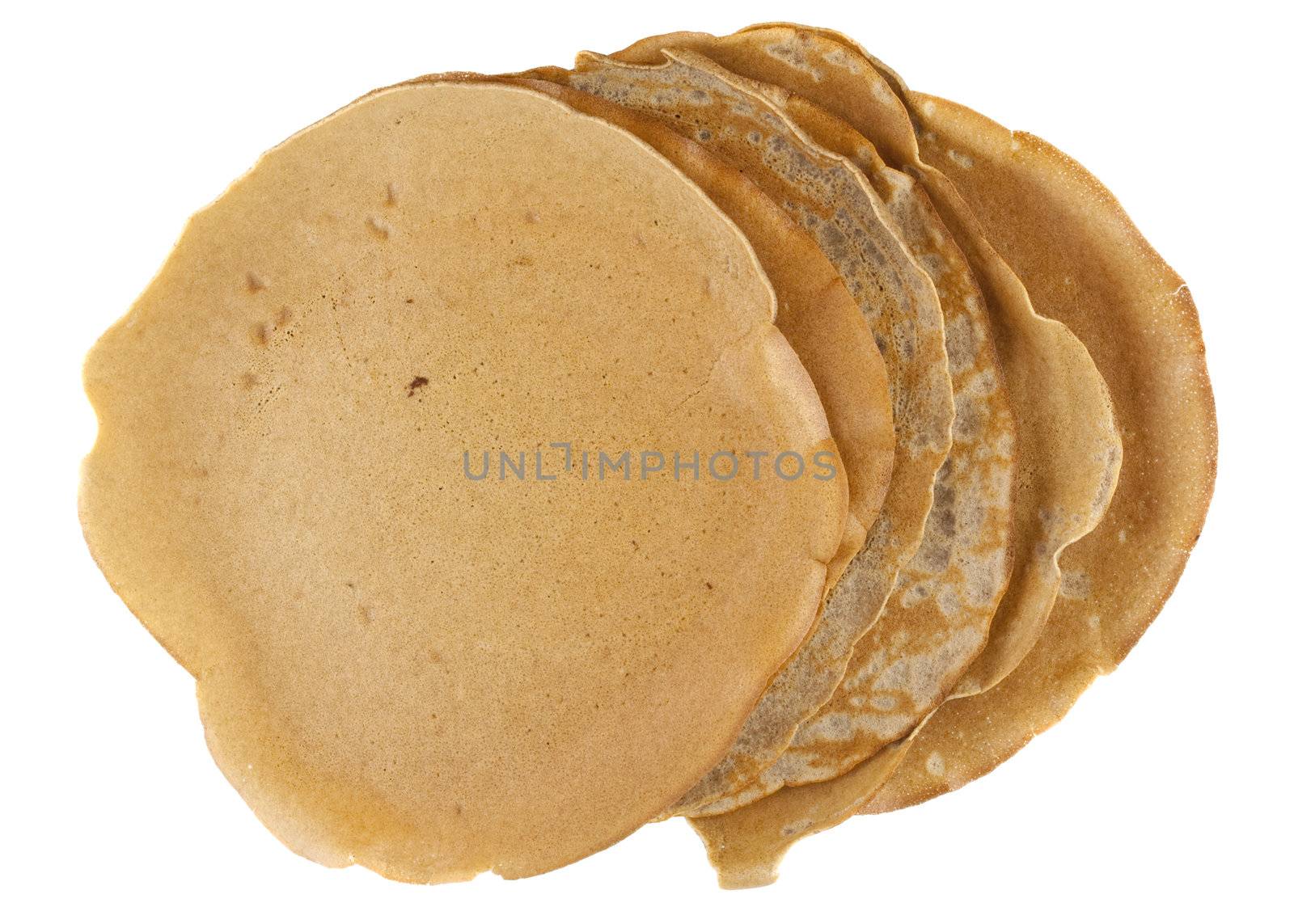 stack of homemade buckwheat flour crepes with irregular edges isolated on white
