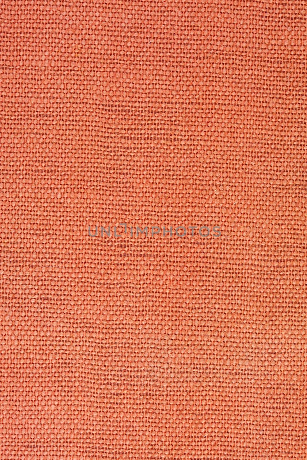 orange, coarse textile background from a vintage 1960s book cover