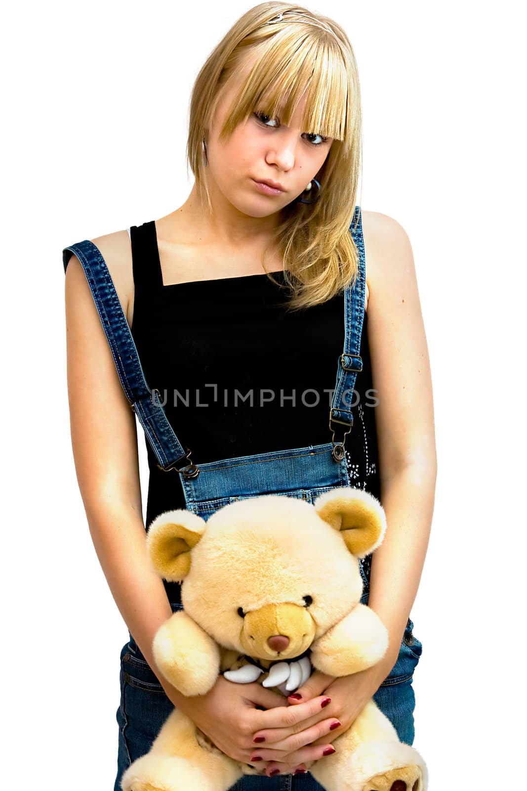 Young girl with a toy bear