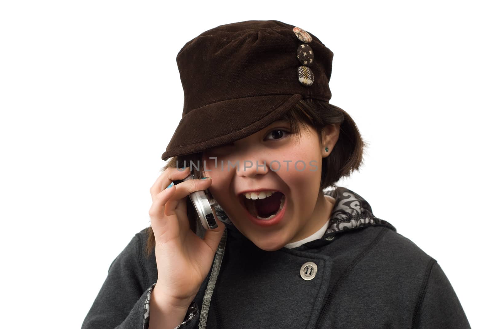 Young girl looking excited while talking on a cell phone, isolated against a white background