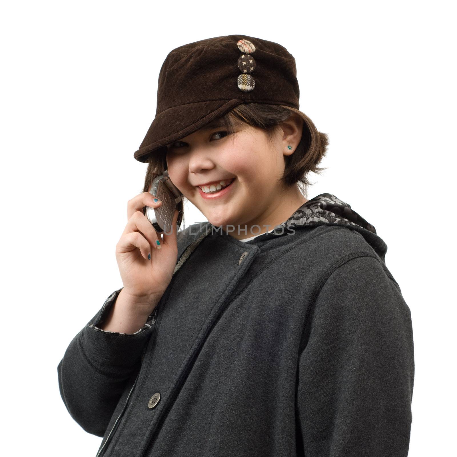 A young child having a phone conversation, isolated against a white background