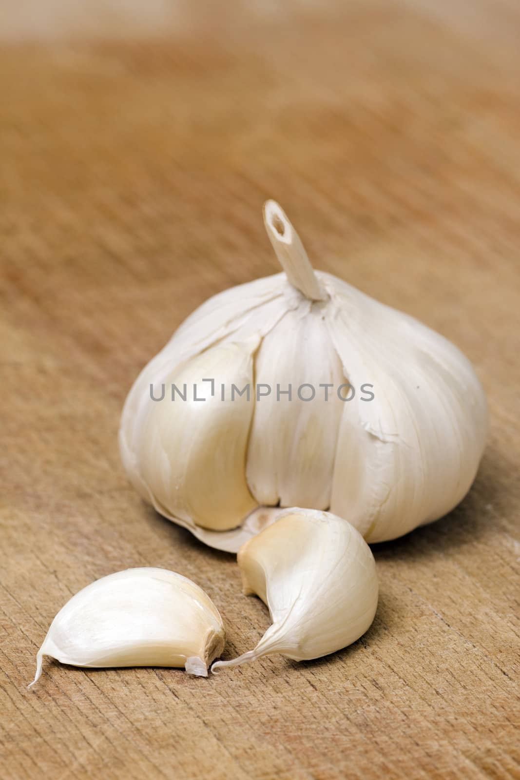 Garlic on a wooden cutting table