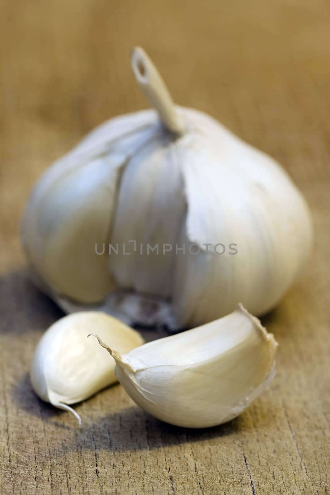 Garlic on a wooden cutting table