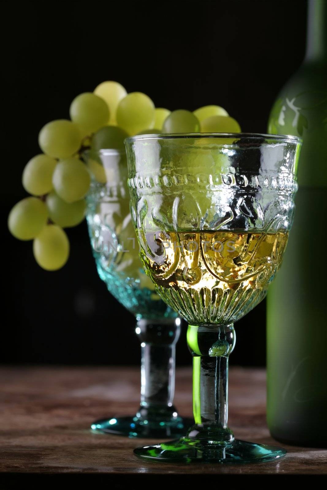 goblets with vine and grape