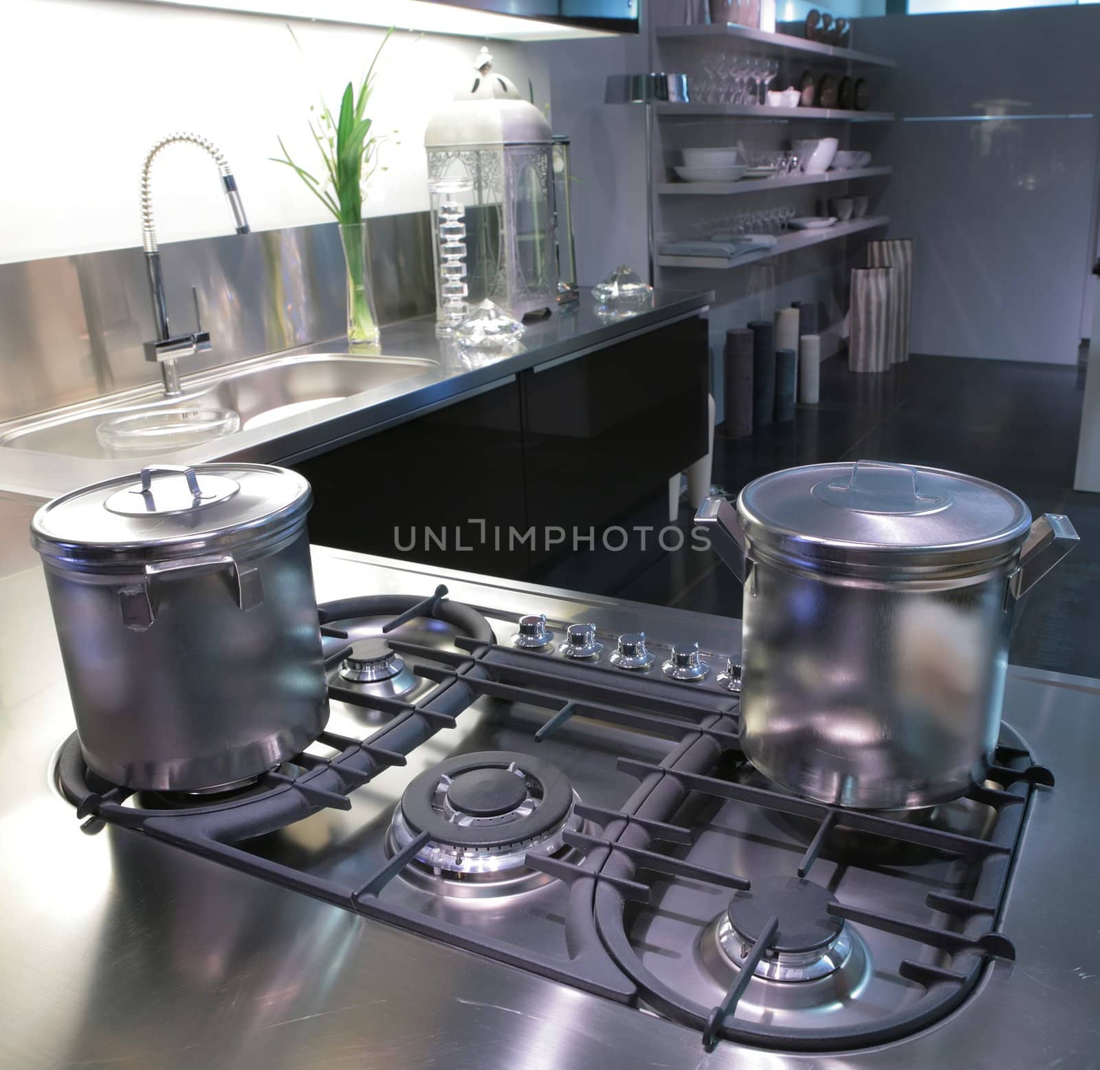 interior of modern kitchen with steel saucepan