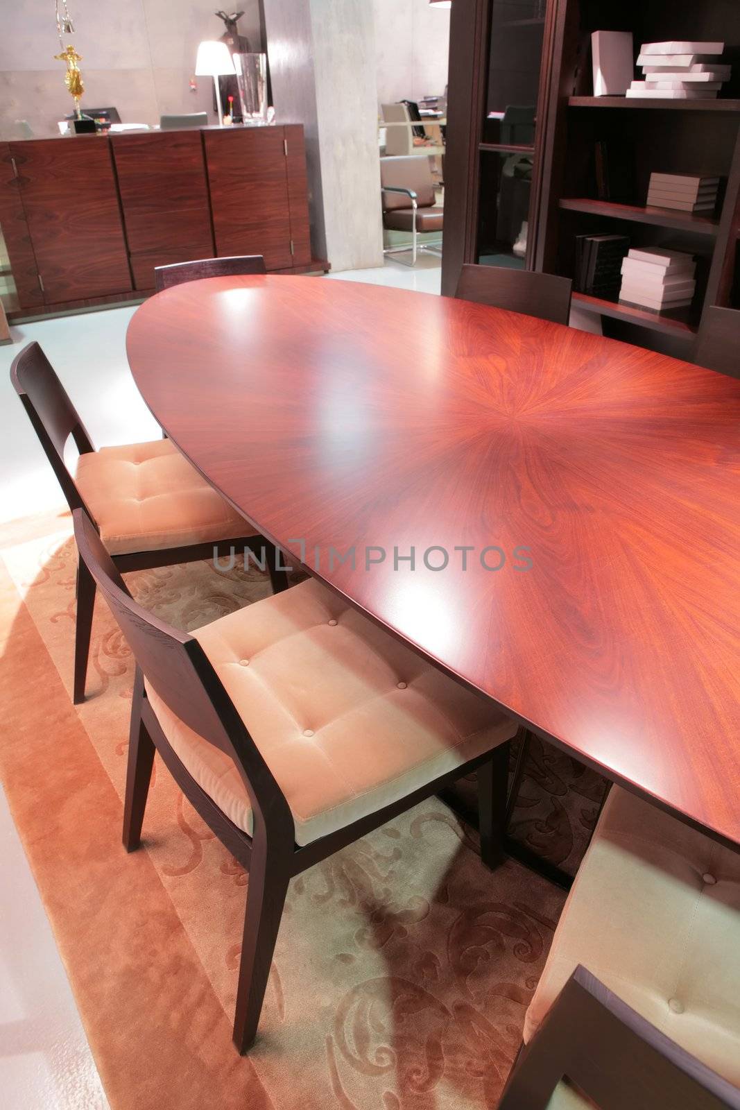 oval table and soft chair in classical drawing room