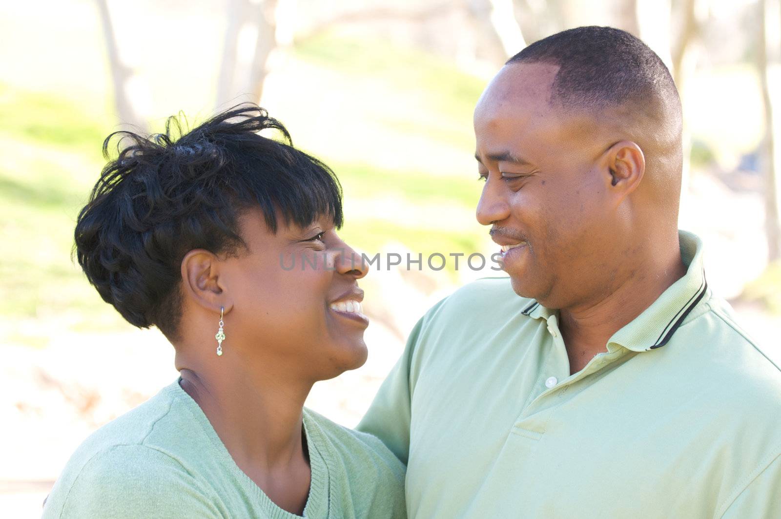 Happy Affectionate Couple posing in the park.