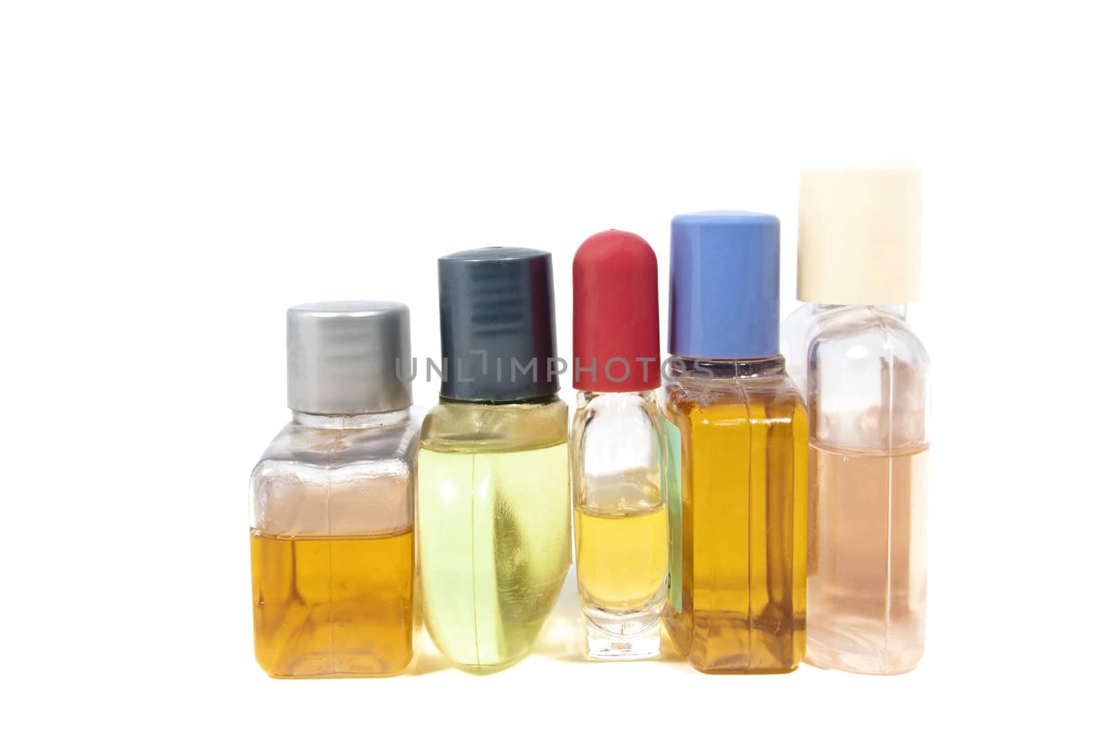 Small shampoo bottles isolated on white background