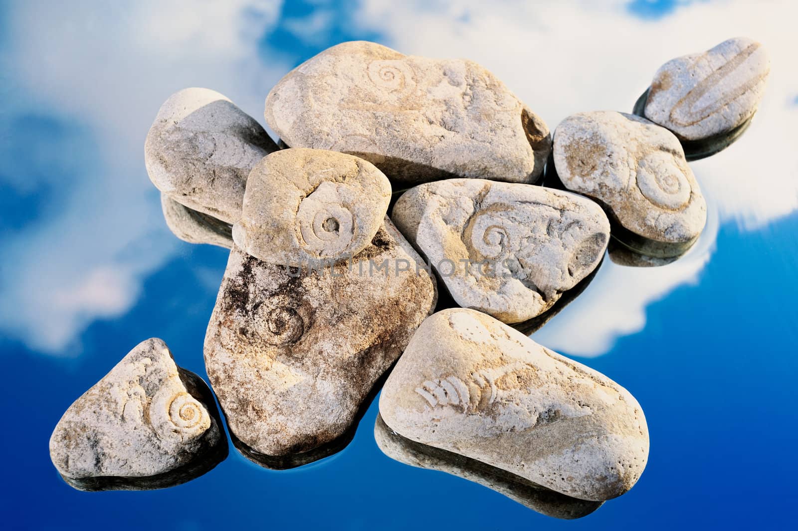 Motley stones in the blue sky on seacoast