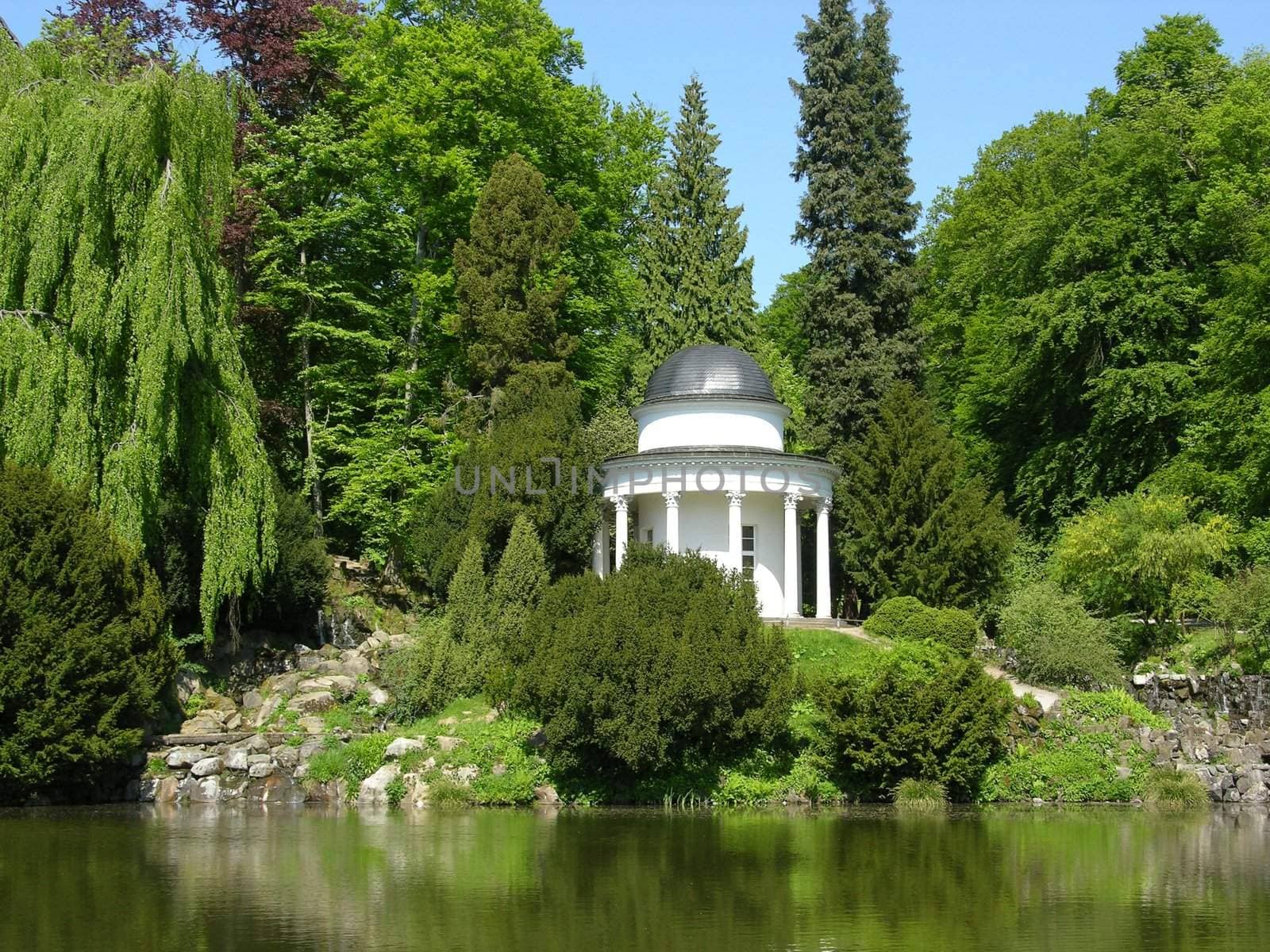 Ancient pavilion in a magnificent park scenery