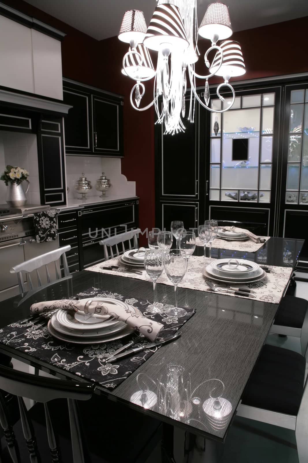 interior of modern dinning-room in monochrome style with served table