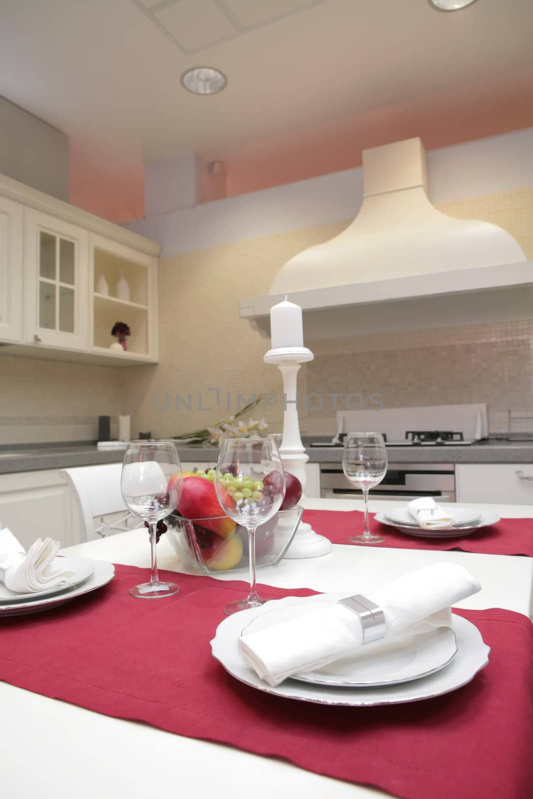 blanching napkin in silvery metallic ring on set table in interior of the modern kitchen