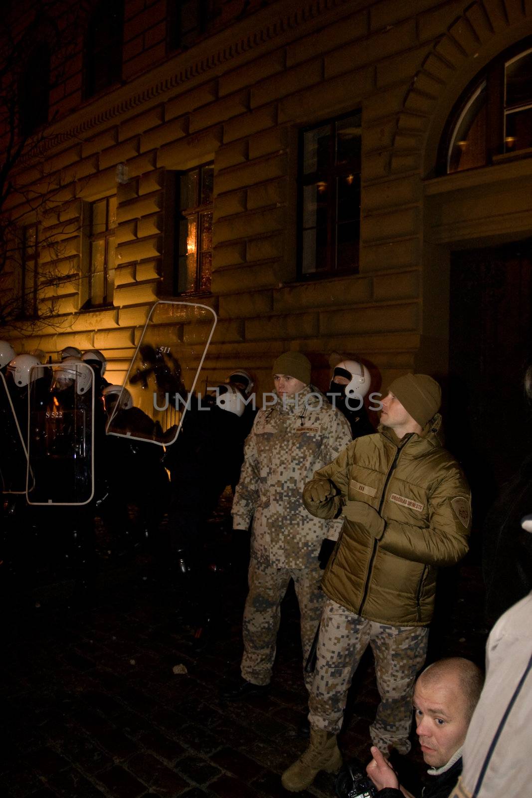 Agresive crowd and police near Latvian Parliament. Riga, Latvia, January 13, 2009